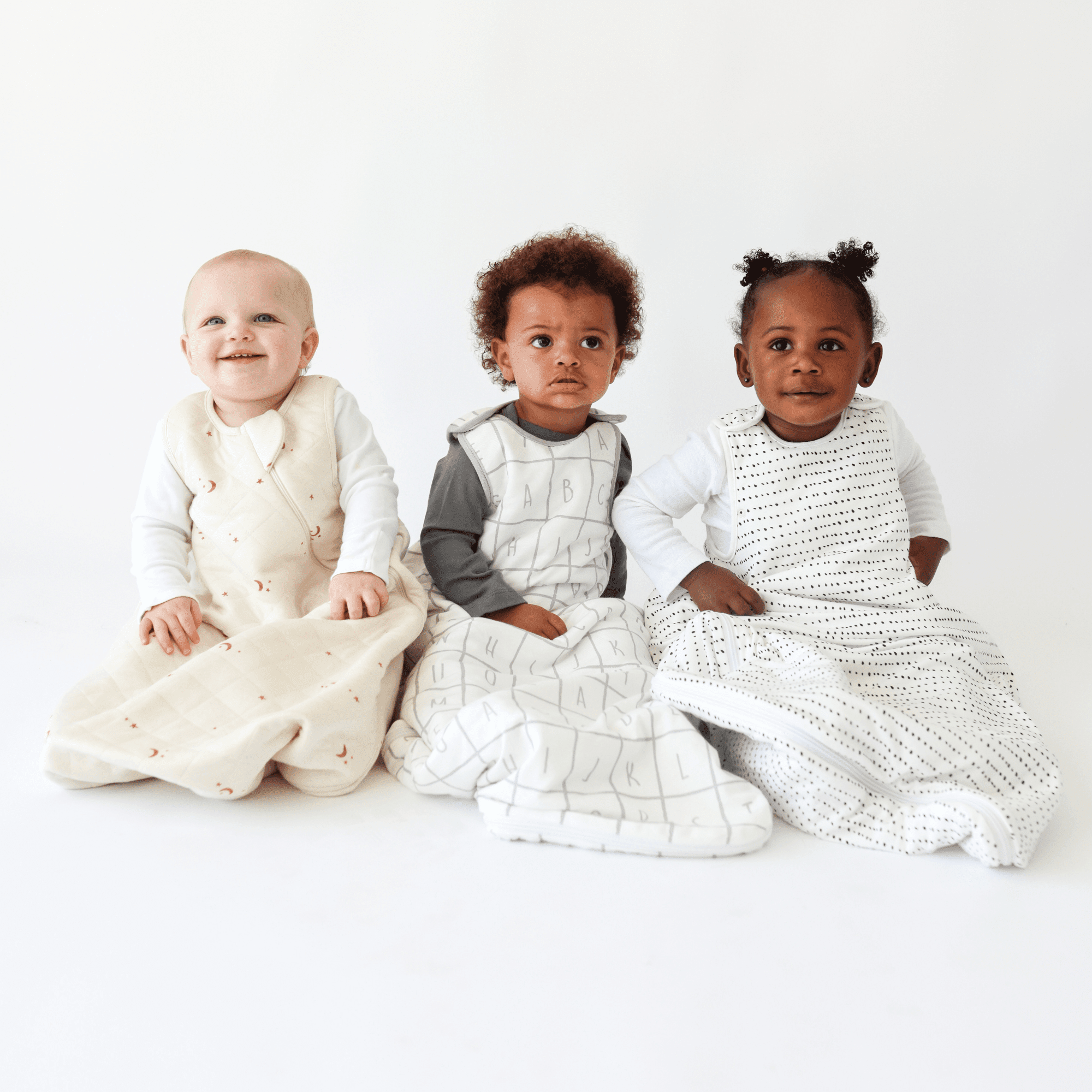 Toddlers wearing Tealbee Dreambag in different designs and TOG