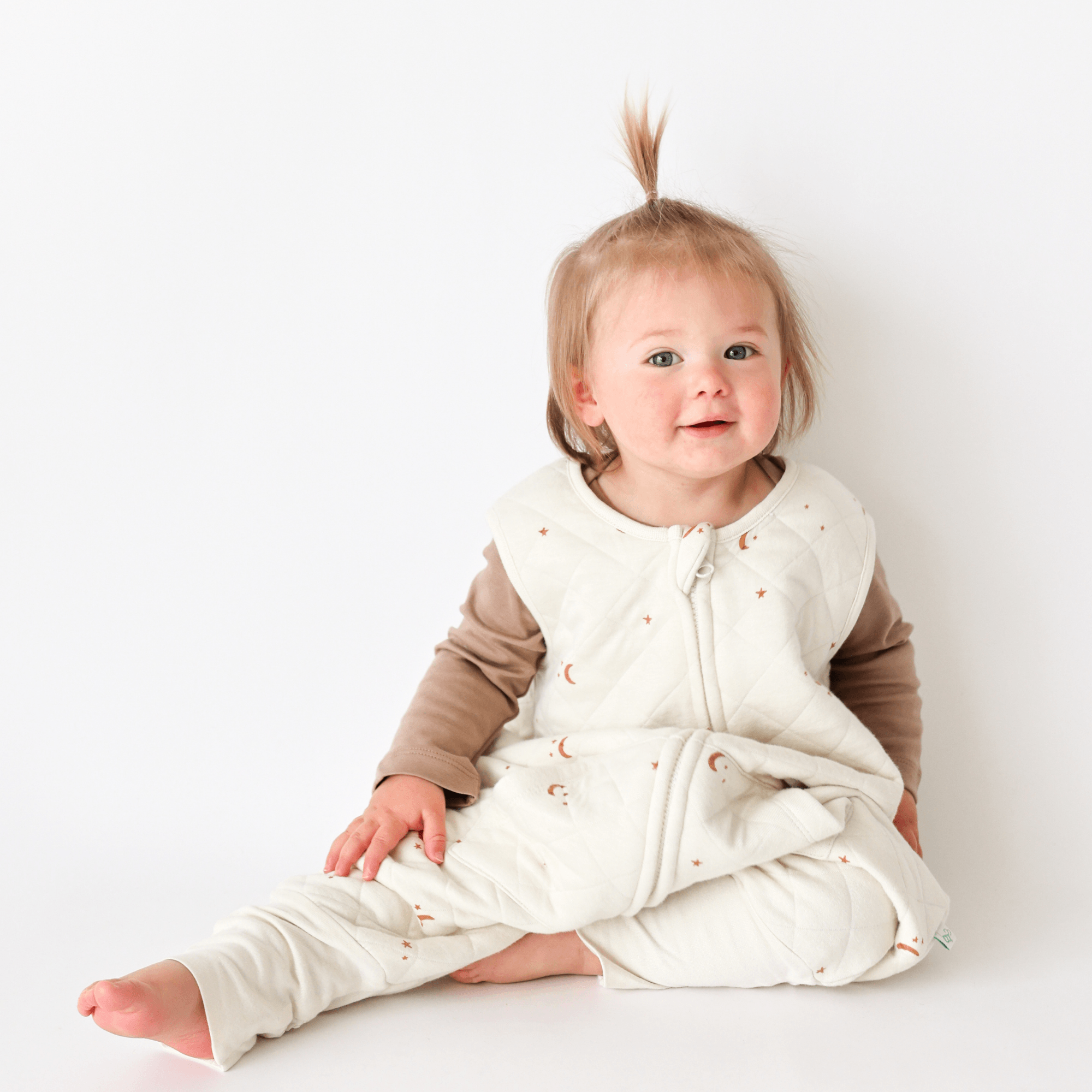 Toddler seating wearing Tealbee Moon & Stars Dreamsuit 1.2 TOG